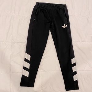 Men’s black Adidas track pants, size medium, tapered fit.